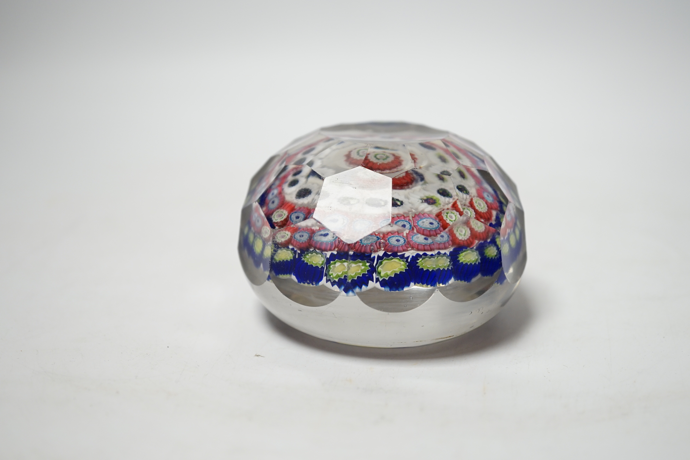 A 19th century French faceted glass paperweight, 8cm diameter